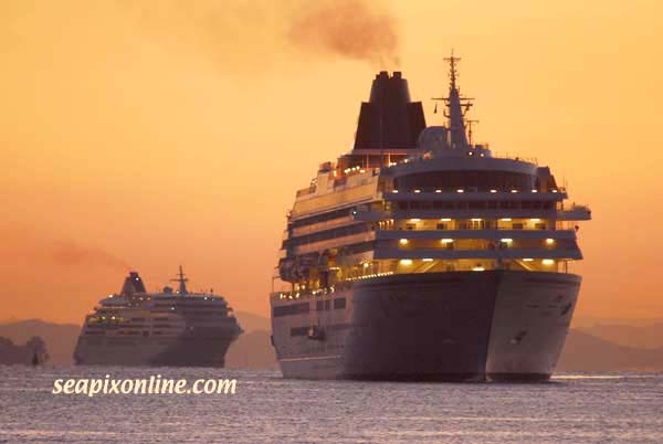 ASUKA II (1990/50142grt/IMO 8806204, ex-CRYSTAL HARMONY) leads Hapag-Lloyds' EUROPA (1999/28890grt/IMO 9183855) into Aucklands' Waitemata Harbour moments before sunrise. They are two of ten major cruiseship visits to the port over ten days 10-17 February 2007, the busiest period for passenger numbers ever. 14 February 2007. Photo by SeapixOnline.com/Trevor Coppock